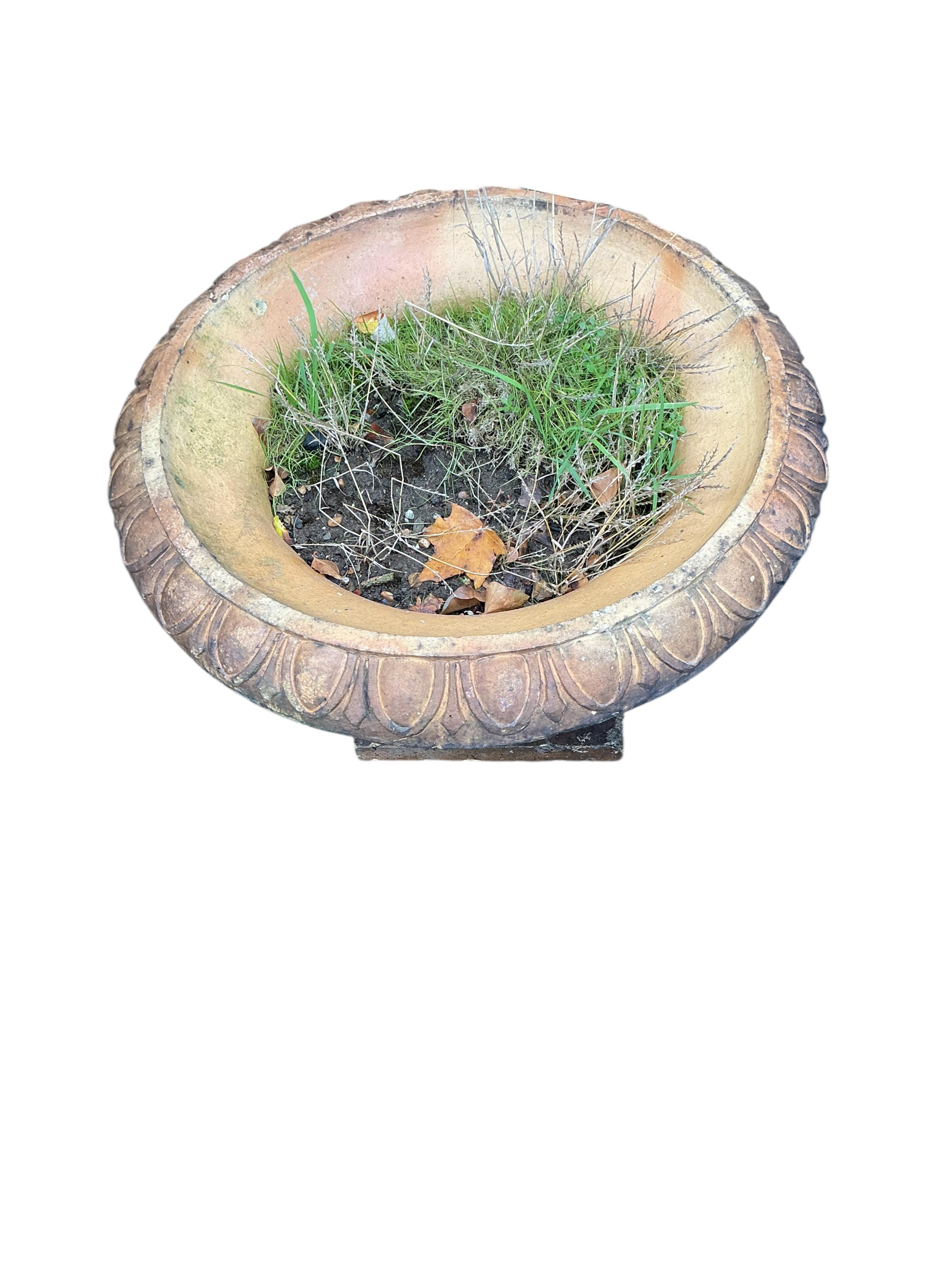 A pair of earthenware campana garden urns, diameter 54cm, height 37cm